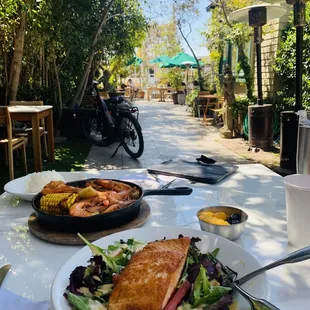 4/8/23 Perfectly cooked Salmon salad, fruits on the side (Hubby's Salmon Frenzy in the background)