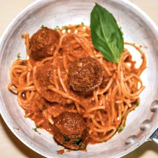 a bowl of spaghetti and meatballs