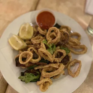 a plate of squid and vegetables