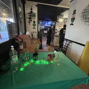 a table with a green table cloth