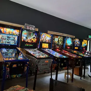 a row of pinball machines