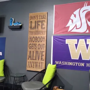 two chairs and a sign on the wall