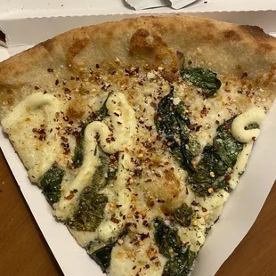 a slice of pizza in a box