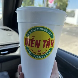 a person holding a cup