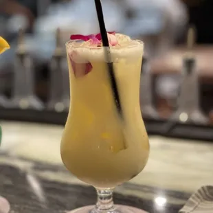 two cocktails on a bar