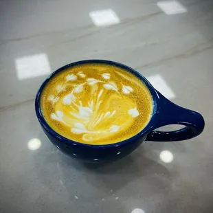 a cup of coffee on a table