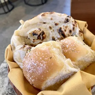 House Rolls and Garlic Coriander Naan - the naan was super delicious but the house rolls were bland and too much salt on the surface