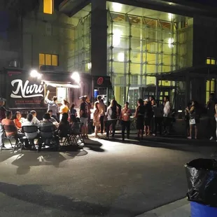 a group of people standing outside