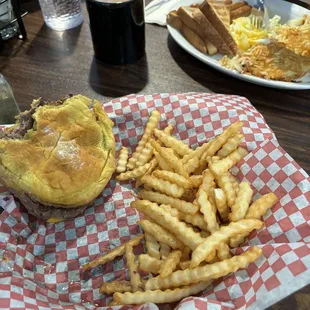 Mine: Cheeseburger with American cheese, French fries.   His plate: Hash browns, toast, sausage, eggs