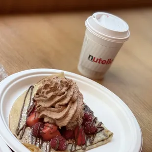 Crepe with strawberries and Nutella cream and a mocha