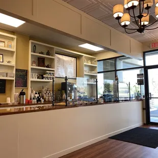 a woman standing in front of the counter