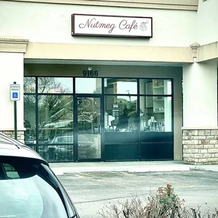 a car parked in front of the building