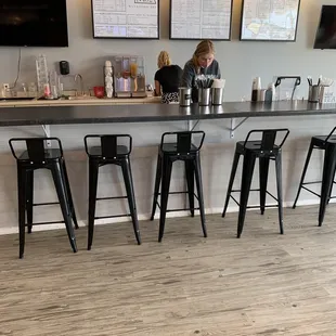 a woman sitting at a bar