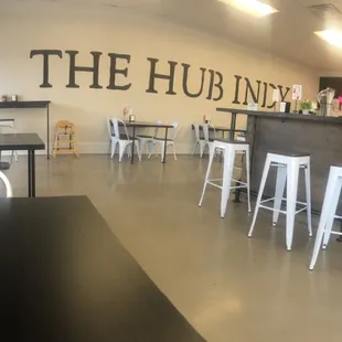 Inside views. Both counter top and low table seating. Plus a fun photo wall.