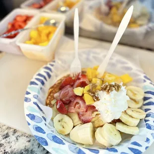 a plate of fruit and yogurt