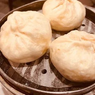 four buns on a grill