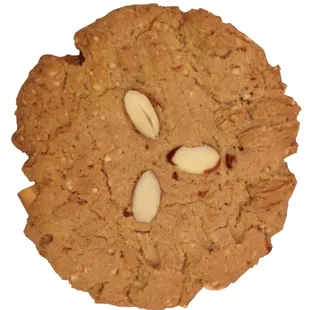 Almond butter cookies with almond flour, chunks of roasted almonds chopped and topped with almond slices