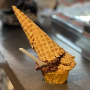 a cone of chocolate ice cream