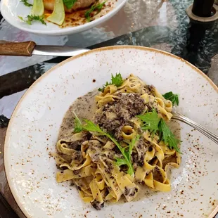 Mushroom Pasta (front)  Pork Chop (back)