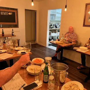 a group of people sitting around a table