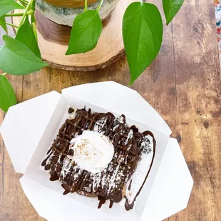 Chocolate Belgian Waffle with chocolate drizzle, whip cream and powdered sugar