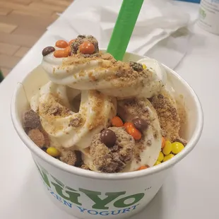 Cookies and cream froyo on the bottom and cake batter on top. Topped w/ butterfinger, reeses pieces, and snickers candies. Lol