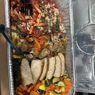 Italian sausage and pepper pasta, focaccia bread, and vegetable medley