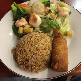 Shrimp with vegetables with fried roasted vegetables and egg roll