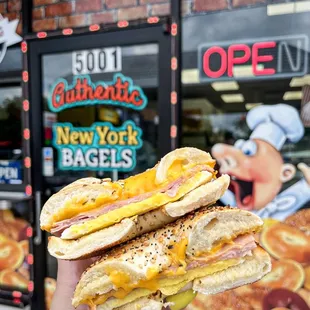 a hand holding a sandwich