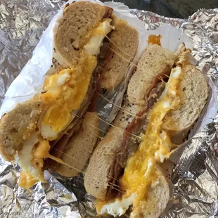 two sandwiches on tin foil