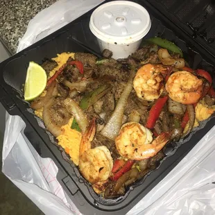 Steak and shrimp fajita with rice and beans!
