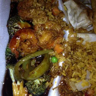 The shrimp and veggies drowning in the sauce. Flavor nice too much sauce.
