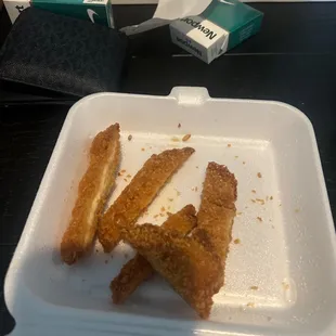 chicken strips in a styrofoam container