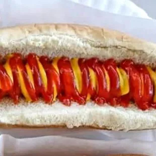 a hot dog with ketchup and mustard