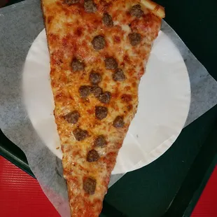 Huge slice of pizza.