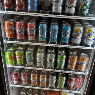 a refrigerator full of sodas