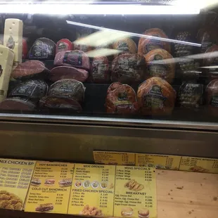 a display of meat in a deli