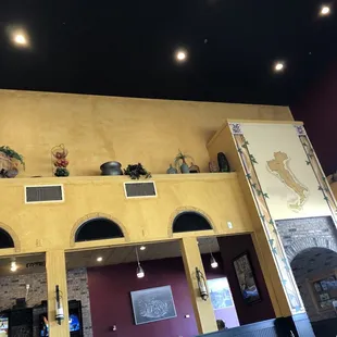 A beautiful painted map of Italy along with decorations.