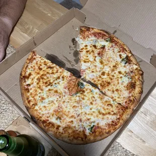 a half eaten pizza in a box