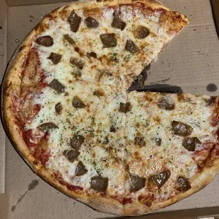 a half eaten pizza in a box