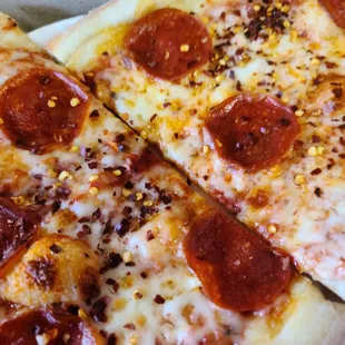 two slices of pepperoni pizza