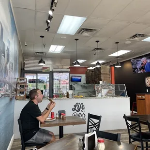 a man sitting at a table eating