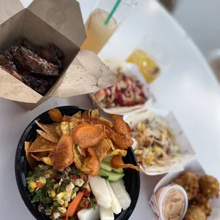 Calypso guacamole, sweet corn fritters, The Roatan (tilapia) taco, The Floridian (coconut shrimp) taco, and the Guava Wings