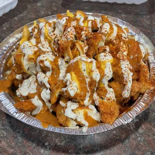 Salito Fries - seasoned fries with chopped chicken tenders, chipotle and white sauce