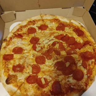 a pepperoni pizza in a box