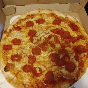 a pepperoni pizza in a box