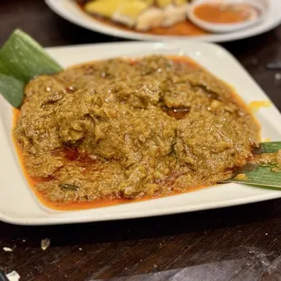 Beef Rendang - tender beef, slowly simmered in a coconut milk curry spiced with cinnamon, cloves, and lemongrass