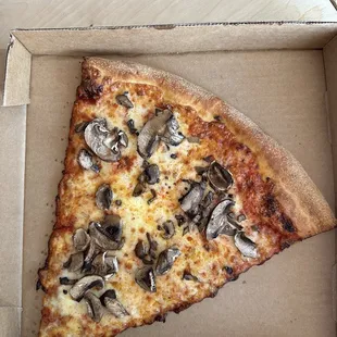 Pizza slice in the box for takeout