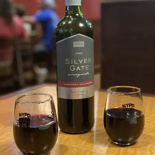 a bottle of wine and a glass of wine