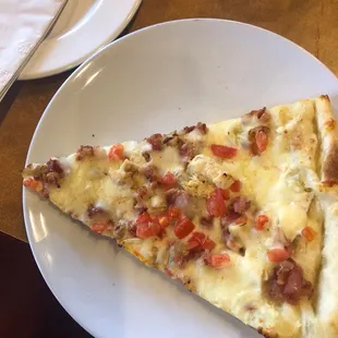 A slice of the special of the day pizza